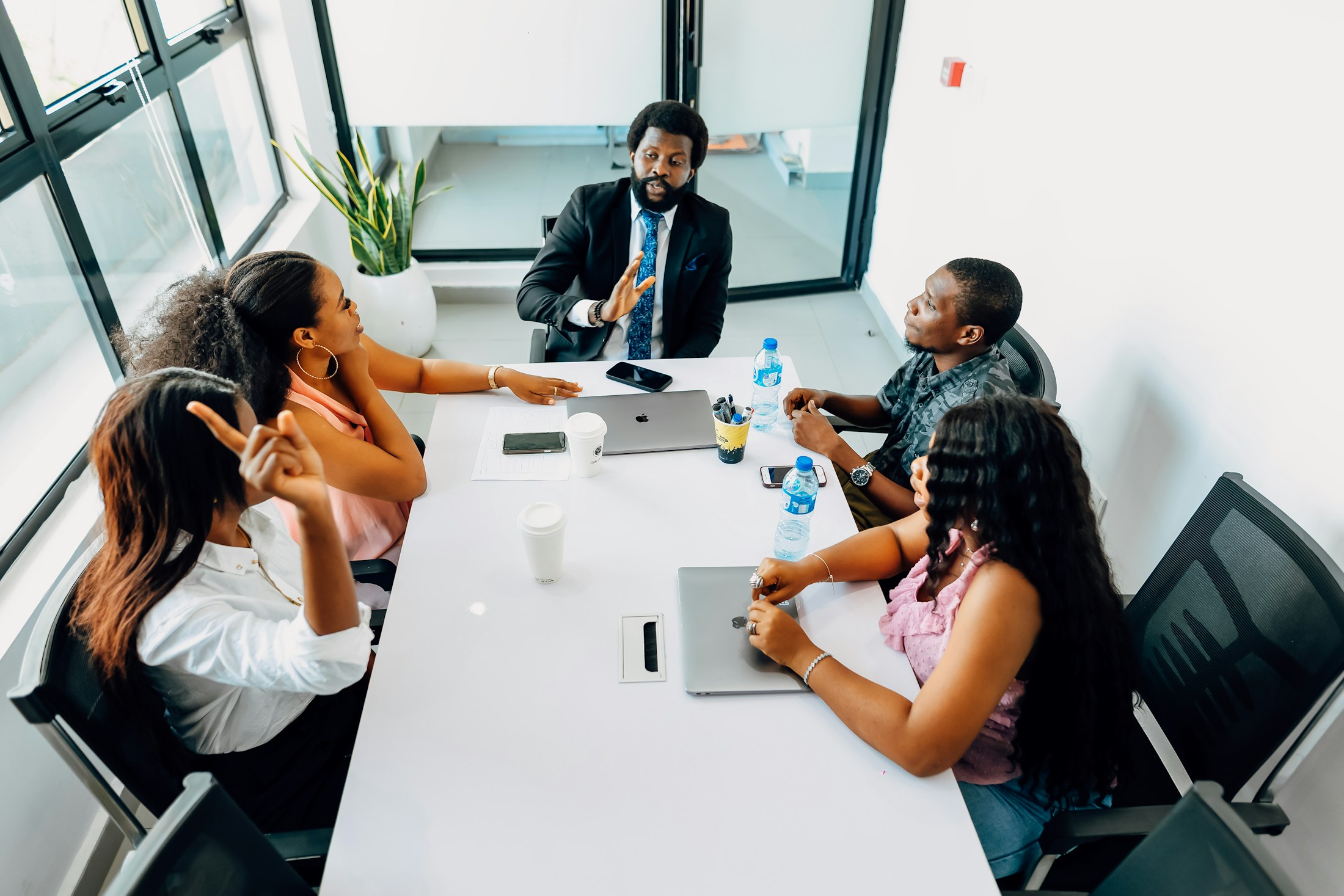 Nigerian business professionals collaborating around a conference table